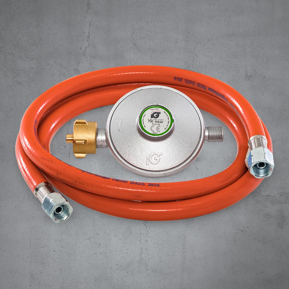 Regulador de presión y conducto de gas contenidos en el volumen de suministro